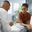 doctor-taking-care-afro-american-child